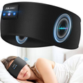 Bluetooth sleep headphones eye mask with built-in speakers and on-mask music controls shown on sleeping woman