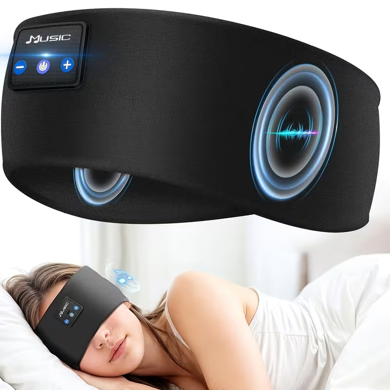 Bluetooth sleep headphones eye mask with built-in speakers and on-mask music controls shown on sleeping woman